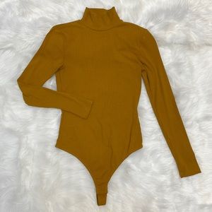 Elodie Ribbed Turtleneck Long Sleeve Bodysuit in Mustard Yellow